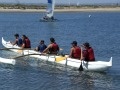 Students paddling an outrigger canoe