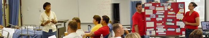 This is a picture of a students and instructors in a nursing classroom.